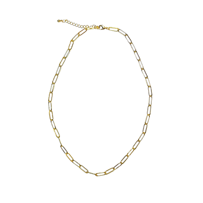 Gold paperclip chain necklace on a white background