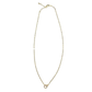 Gold necklace with a small bail on a white background