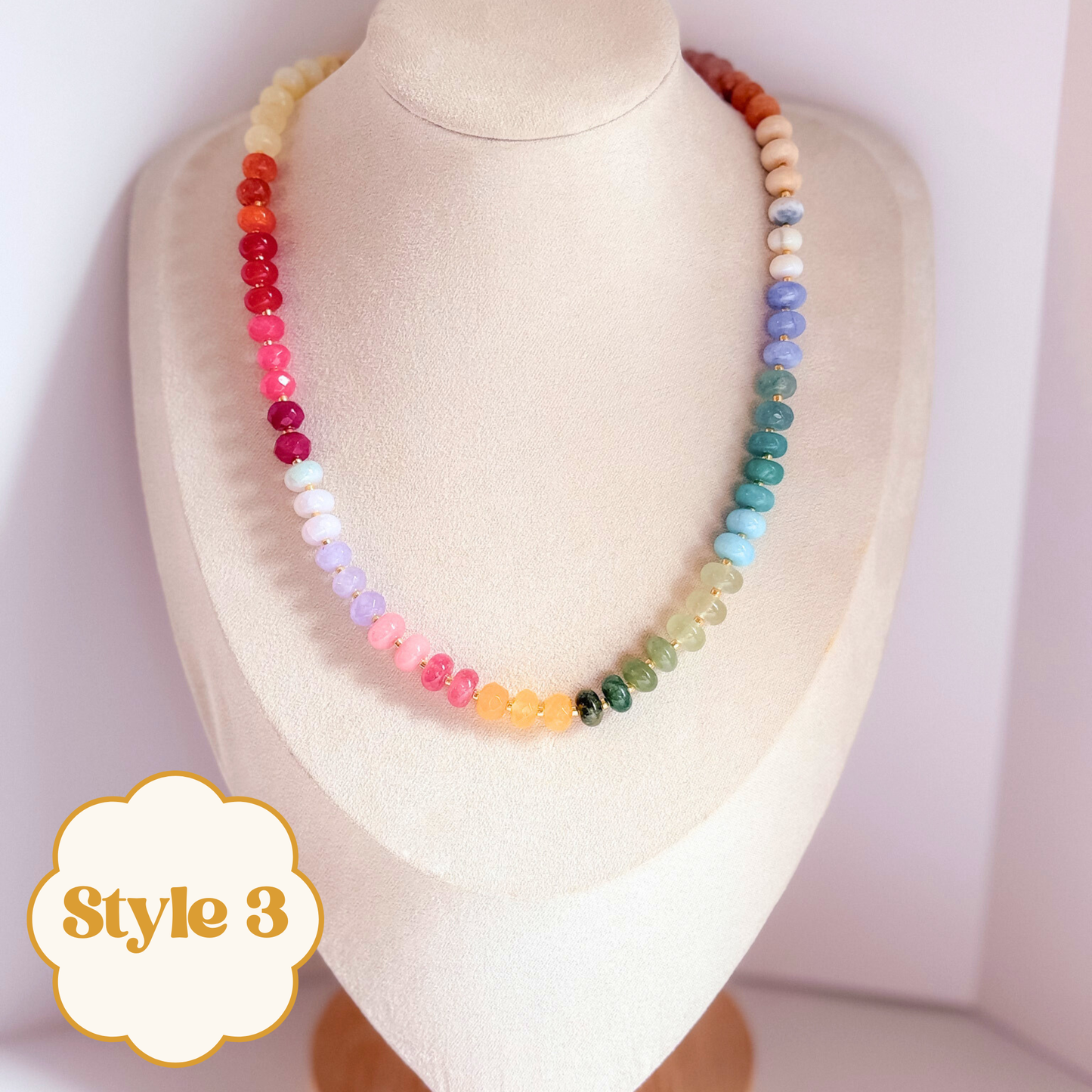 Multicolor beaded gemstone necklace on a mannequin. 