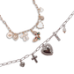 Two charm necklaces with various charms on a white background