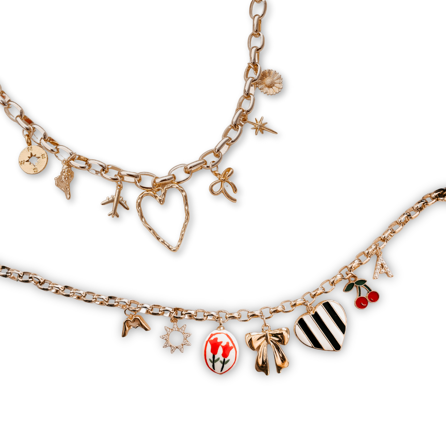Gold charm necklaces with various charms on a white background
